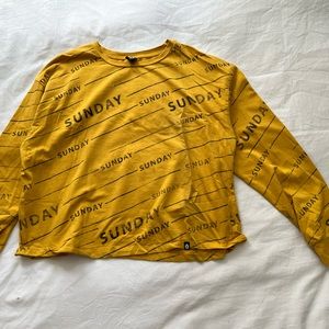 “Sunday” shirt in yellow/orange with black writing